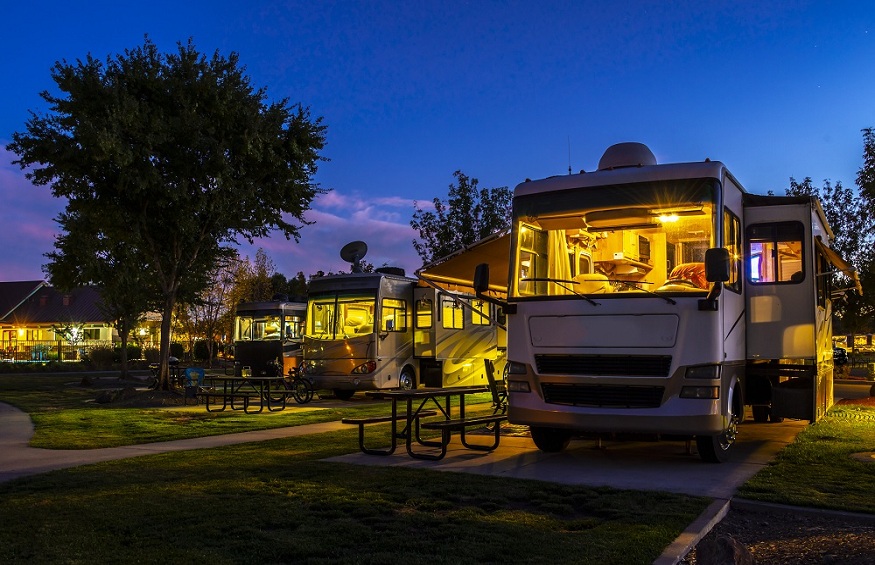 Rving at a resort in the evening lighted sky with class A rigs i